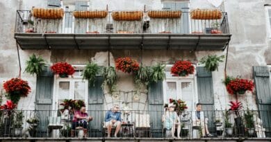 People Sitting on the Balcony of a Building in the French Quarter in New Orleans, Louisiana