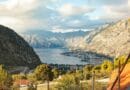 A breathtaking view of Boka Bay with surrounding mountains and a picturesque coastal town in the distance.
