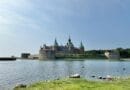 Stunning view of Kalmar Castle with its reflection in the water on a clear summer day.