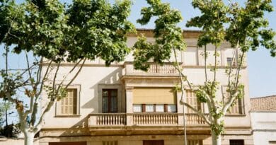 A building with a tree in front of it