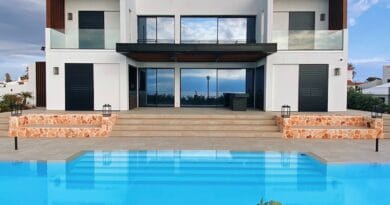 white and brown house near swimming pool