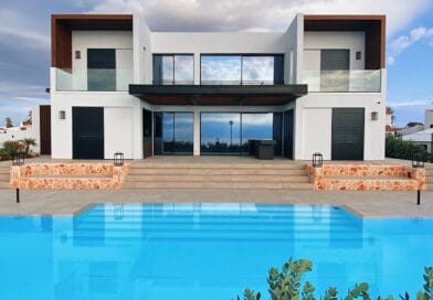 white and brown house near swimming pool