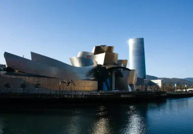 gray concrete building near body of water during daytime