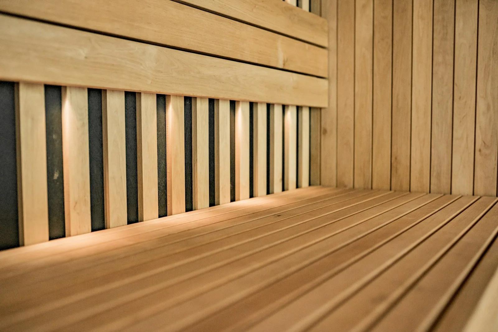 a close up of a wooden bench with slats