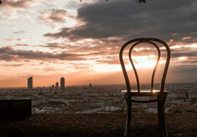 brown wooden chair on beach during sunset