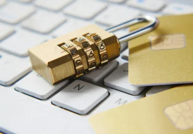 a golden padlock sitting on top of a keyboard